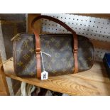 A brown Louis Vuitton print handbag with tan trim [upstairs wooden shelves] TO BID ON THIS LOT AND