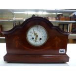 An early 20th century mahogany and marquetry mantel clock with prettily painted enamel dial to a