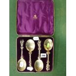 A good late Victorian set of four silver-gilt fruit serving spoons in archaic style, London 1880, in