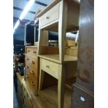 A pair of modern bedside tables in light wood, possibly from John Lewis, each with a frieze