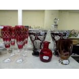 A pretty pair of ruby overlaid glass vases, a set of six cranberry cut glass wine glasses, a ruby
