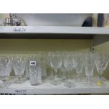 A set of Stuart crystal wine glasses, a set of nine Royal Doulton cut glass wine glasses plus six