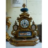 A late 19th century French gilt spelter mantel clock, inset with Sevres-style porcelain, with a