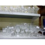 A quantity of glass ware comprising mainly wine glasses, brandy balloons, sherry glasses and