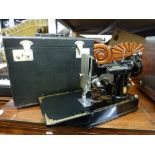 A cased early 20th century Singer sewing machine CAT.C.A.K.6.11 and a Panasonic Inverter