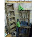 Four old wooden folding garden chairs and an old set of wooden step-ladders. TO BID ON THIS LOT
