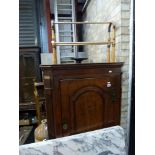 An 18th century oak corner cupboard, the dome panelled door cross-banded with mahogany, flanked by