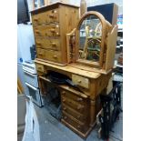 A modern pine lot comprising a chest of four drawers, a dressing table, a desk of four drawers and