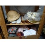 Two shelves of ladies' clothing and accessories including two pairs of Ferragamo shoes, Kurt