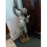 A lead fountain head modelled as a child playing a musical instrument TO BID ON THIS LOT AND FOR