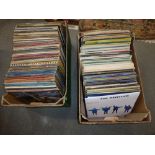 Two boxes containing an assortment of 12 in records, but mainly rock and pop LPs from the 1970s