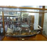 A large and impressive professionally built model of the 'Cutty Sark' in wooden and glazed case,