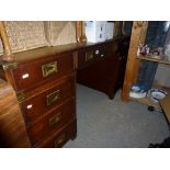 A substantial mahogany pedestal desk of nine drawers in the Naval style, with inset brass handles
