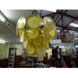 An unusual 1960s electrolier hung with yellow glass discs TO BID ON THIS LOT AND FOR VIEWING