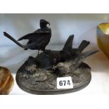 A 19th century French bronze group by J. Moigniez of a pair of birds with fledglings, 18.6 cm