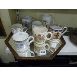A vintage hexagonal mirror and seven commemorative mugs by Aynsley, Wedgwood etc. [s78] TO BID ON