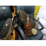 A musical instrument lot comprising a mandolin by G. Grandini, a mandolin in case, a violin with