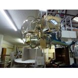 A stylish 1960s ceiling light hung with circular smoked glass discs TO BID ON THIS LOT AND FOR