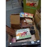 A carton of games, including a compendium, Totopoly, playing cards, etc., and a small selection of
