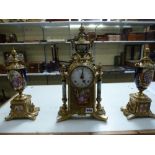 A modern very decorative Italian clock garniture in cast brass and ceramic, half-hour chiming on two