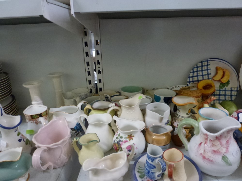 A collection of pottery jugs and mugs, a pair of white glazed candlesticks, two pottery planters, - Image 2 of 2