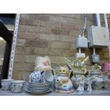 Two shelves of china including a German blue and white part tea service in the Meissen style,