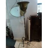 A good quality mid-20th century French uplighter in bronzed metal on a turned column and four