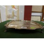 A substantial Edwardian silver salver, shaped square on four feet, initialled B, 10.75 in across,