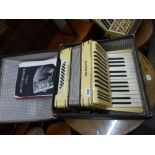 Two Hohner accordions: Student 3, in box, and Tango 5, with music book [on 917] TO BID ON THIS LOT