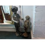 Two lead garden ornaments modelled as figures of children TO BID ON THIS LOT AND FOR VIEWING