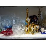 A shelf of glass ware including a pair of large cut glass vases, plus two further similar, two glass