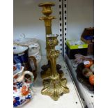 A French Empire candlestick in ormolu and bronze and a later 19th century brass candlestick [Y] TO