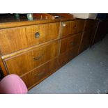 A good quality long low chest of nine drawers, well-constructed with brass inset handles, possibly
