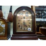 A German mantel clock, early 20th century, signed W&H Sch., chiming on two gongs, in arched oak