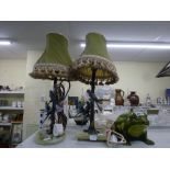 Two vintage table lamps, each with cold-painted cast brass stem with budgerigars, on onyx base,