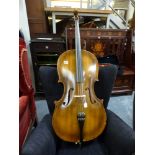 A 3/4 size cello with two piece back, Golden Strand label imported by Boosey & Hawkes, London,