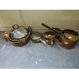 A quantity of 19th century and later copper and brass jam pans, cooking pots and sauce pans [under