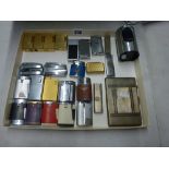 A collection of cigarette lighters, mid- and later 20th century, almost all for gas, including