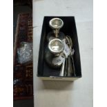 A pair of filled silver dwarf candlesticks and five small silver golfing spoons, 2.4 ozt weighable