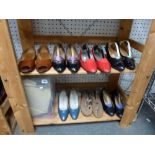 Two shelves of ladies' shoes including Ferragamo, Christian Dior and Bruno Magli [upstairs wooden