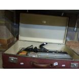 A vintage leather case containing a Black & Decker Hammer Drill, a vice and other tools. [under G16]