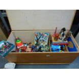 A pine lift up lid toy box and contents including puzzles and dolls TO BID ON THIS LOT AND FOR