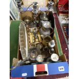 A carton of silver-plated items, including a candelabrum, hot water jug, crucifix, basket, pair of