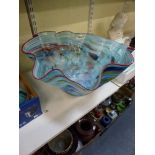 A large colourful glass bowl, probably Murano, with wavy red rim, 44 cm across [C] TO BID ON THIS