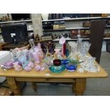 A large glass lot including coloured glass ornaments and baskets, six paperweights including Isle of