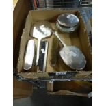 A George VI silver dressing table set of silver-lidded powder bowl, hand mirror, three brushes and