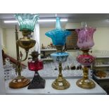 Four 19th century and later glass and brass oil lamps including Duplex [S1] TO BID ON THIS LOT AND