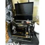 A small boxed vintage Singer sewing machine with food pedal [under s79] TO BID ON THIS LOT AND FOR