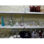 A quantity of glass ware including a perfume bottle and stopper, glass vases, paperweights