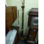A substantial brass column standard light on paw feet and a modern standard lamp. TO BID ON THIS LOT